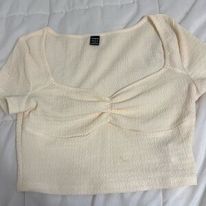 Cream short sleeve be crop top.